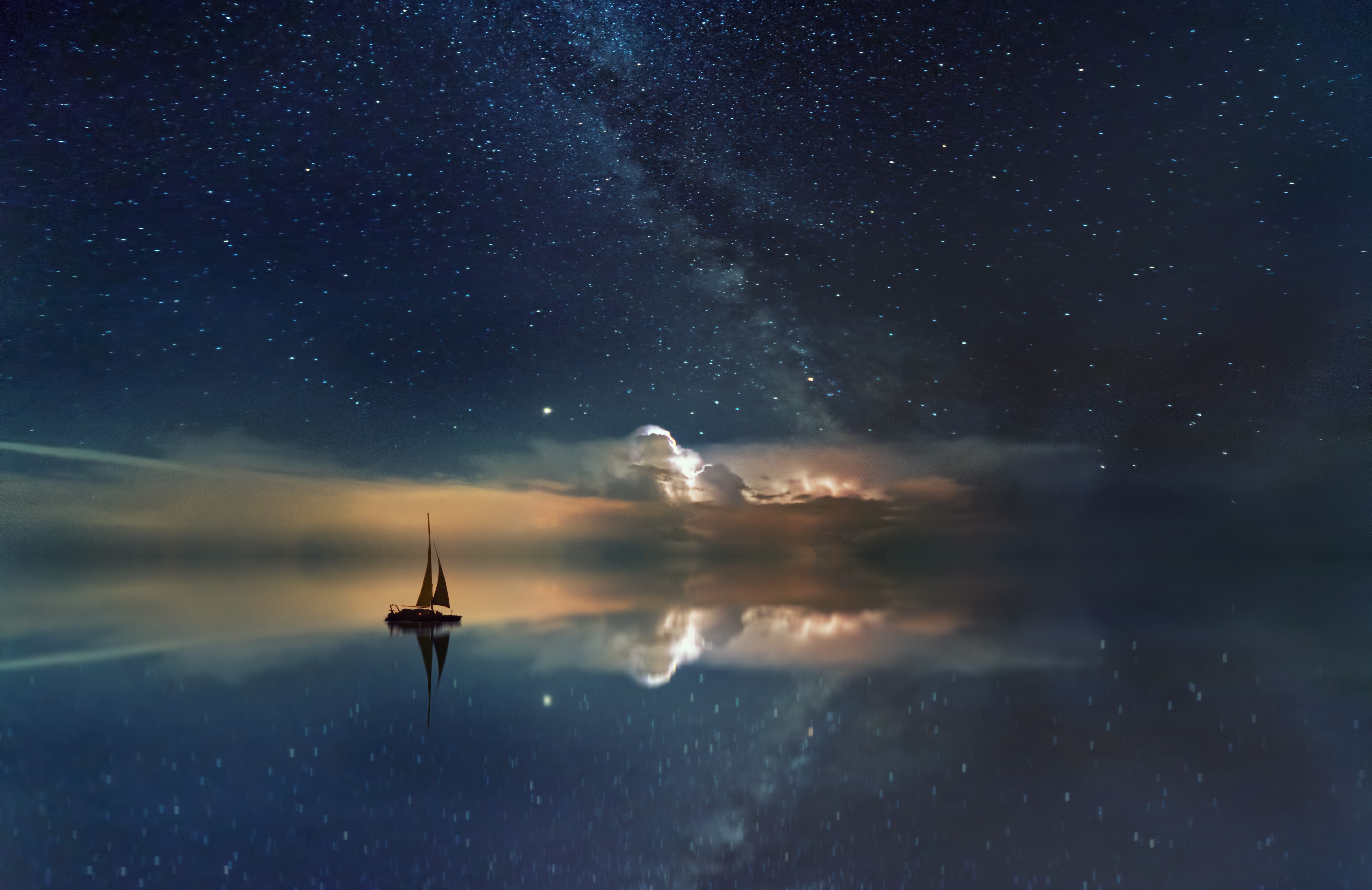 Picture of boat in the sea reflecting the sky